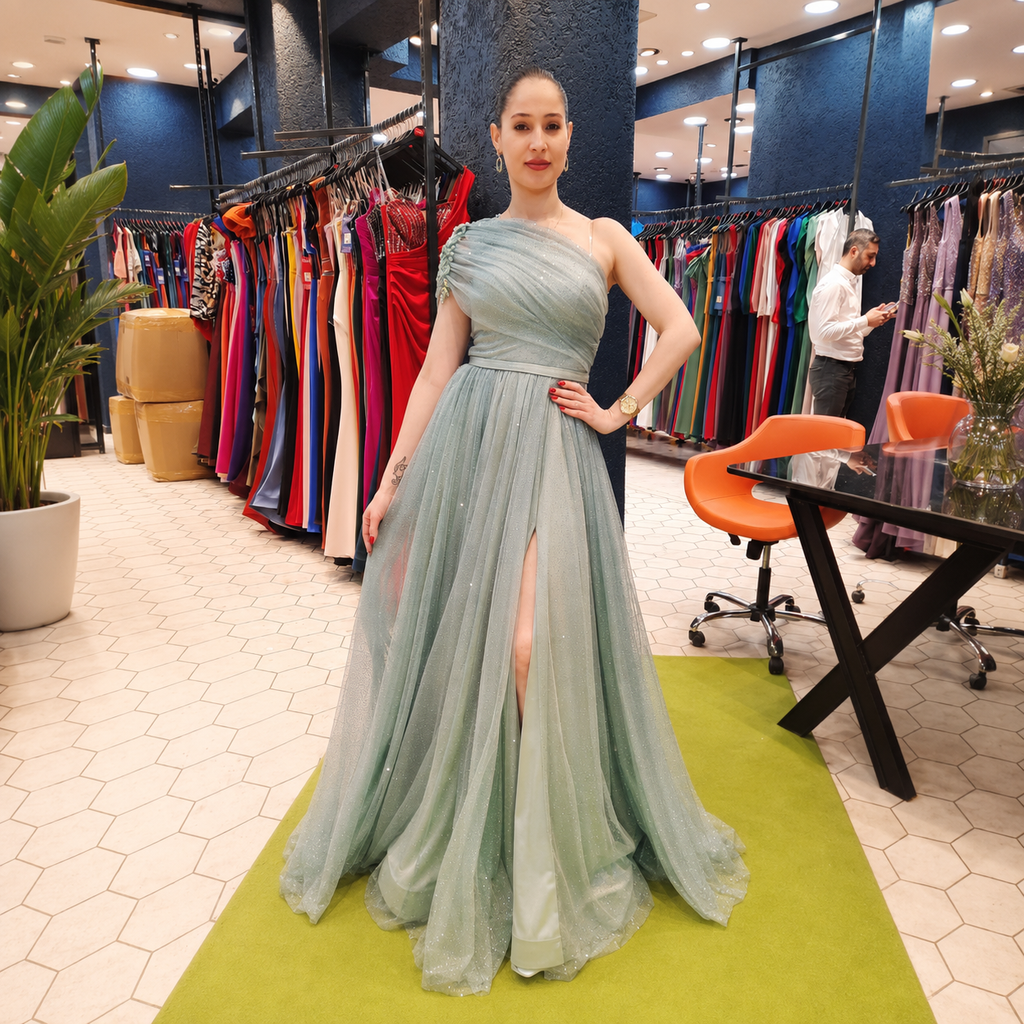 Long light blue one-shoulder dress with tulle and slit